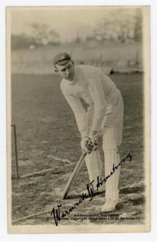 Warwick Windridge Armstrong. Victoria & Australia 1898-1922. Original mono real photograph postcard of Armstrong standing full length at the wicket in batting pose, wearing an Australia cap. Beautifully signed in black ink to the photograph by Armstrong. 