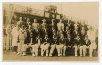 Wales v New Zealand 1927. Rare sepia real photograph postcard of the two teams seated and standing in rows wearing cricket attire and blazers, the pavilion in the background. Taken at the drawn tour match played at The Oval, Llandudno, 3rd- 5th September 