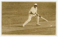 Thomas Coleman ‘Tom’ Lowry. Auckland, Cambridge University, Wellington, Somerset & New Zealand 1917-1938. A rare sepia real photograph postcard of Lowry in batting action for New Zealand in the tour match v Queensland at Brisbane, 4th- 7th December 1925. 