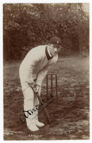 Arthur William ‘Dave’ Nourse. Natal, Transvaal, Western Province & South Africa 1896-1936. Excellent sepia real photograph postcard of Nourse, full length, in batting pose at the wicket, wearing a 1912 South Africa tour cap for the Triangular Tournament h