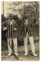 M.C.C. tour to Australia 1924/25. Excellent mono real photograph postcard of the Captain, A.E.R. Gilligan, and vice-captain, J.W.H.T. Douglas. The pair standing full length, both wearing cricket attire and striped blazers. The postcard very nicely signed 