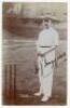 Henry James Huggins. Gloucestershire 1901-1921. Early sepia real photograph postcard of Huggins standing full length at the crease, ball in hand, wearing cricket attire and cap. Beautifully signed in black ink to the photograph. Foster of Brighton. Postal