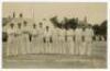 ‘Bournemouth Cricket Week 1913. Hampshire County Team’. Mono real photograph postcard of the Hampshire team standing in one row wearing cricket attire on the field with a marquee and spectators in the background. Players featured are White, Tennyson, Jaqu