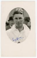 Gerald ‘Gerry’ Hill. Hampshire 1932-1954. Mono real photograph postcard of O’Reilly, head and shoulders in cameo, wearing cricket attire. Nicely signed in blue ink by O’Reilly to the photograph. Official stamp to verso for A. Wilkes & Son, West Bromwich. 