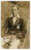 Frank Edward Woolley. Kent & England 1906-1938. Excellent sepia real photograph postcard of Woolley, three quarter length sitting on a chair, wearing M.C.C. touring blazer. Nicely signed in ink by Woolley. Appears to be by Fisk-Moore of Canterbury. Postal