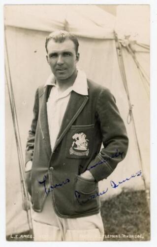 Leslie Ethelbert George ‘Les’ Ames. Kent & England 1926-1951. Sepia real photograph postcard of Ames standing three quarter length wearing his blazer for the 1932/33 tour to Australia. Signed in blue ink to the photograph by Ames. Flemons of Tonbridge. Po