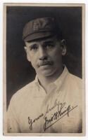 John Herbert King. Leicestershire & England 1895-1925. Sepia real photograph photograph of King, head and shoulders wearing his England cap. Very nicely signed in black ink to the photograph by King. Blind embossed stamp to lower right corner for J. Herbe