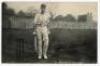 Pelham Francis ‘Plum’ Warner. Oxford University, Middlesex & England 1894-1920. Mono real photograph postcard of Warner standing full length at the wicket, bat in one hand, wearing Middlesex cap. Nicely signed twice in black ink to the image by Warner. Ha