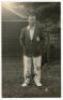 Elias Henry ‘Patsy’ Hendren. Middlesex & England 1907-1937. Mono real photograph postcard of Hendren standing full length wearing M.C.C. touring blazer. Very nicely signed in black ink to the image by Hendren. Blind embossed stamp for Nias of Brighton to 