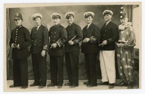 Nottinghamshire 1930s. Unusual mono real photograph postcard of seven Nottinghamshire cricketers standing in one row, posing in naval and police uniforms, and one dressed as a clown. Players featured include Knowles, G. Gunn, G.V. Gunn, A. Staples, Heane,