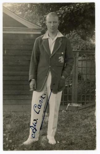 Arthur William Carr. Nottinghamshire & England 1910-1935. Original mono real photograph postcard of Carr standing full length wearing cricket attire and M.C.C. touring blazer. Very nicely signed in black ink to the image by Carr. Blind embossed stamp for 