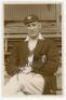 Fred Barratt. Nottinghamshire & England 1914-1931. Original sepia real photograph postcard of Barratt seated three quarter length wearing cricket attire and Nottinghamshire cap and blazer c.1925. Very nicely signed ‘Yours faithfully, T. Barratt’ in ink to