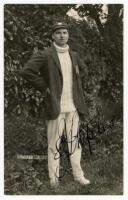 Samuel James ‘Sam’ Staples. Nottinghamshire & England 1920-1934. Original sepia real photograph postcard of Staples standing full length wearing cricket attire and Nottinghamshire cap and blazer c.1925. Very nicely signed in ink to the image by Staples. B