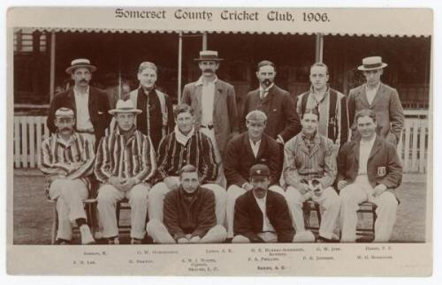 ‘Somerset County Cricket Club, 1906’. Original early sepia real photograph postcard of the 1906 Somerset team. The players are seated and standing in rows wearing cricket attire and assorted blazers and head gear, in front of the pavilion, probably at Tau