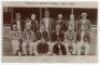 ‘Somerset County Cricket Club, 1906’. Original early sepia real photograph postcard of the 1906 Somerset team. The players are seated and standing in rows wearing cricket attire and assorted blazers and head gear, in front of the pavilion, probably at Tau