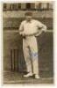 Leonard Charles Braund. Surrey, Somerset, London County & England 1896-1920. Sepia real photograph postcard of Braund, full length, at the wicket wearing cap and holding a cricket ball. Signed in blue ink to the image by Braund. Appears to be Hartmann ser