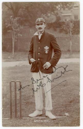 William Charles ‘Razor’ Smith. Surrey 1900-1914. Early mono real photograph postcard of Smith standing full length at the wicket wearing cricket attire and Surrey cap and blazer, cigar in hand. Signed in black ink to the photograph by Smith. Appears to be