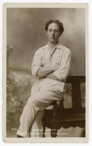 Charles Shaw ‘Charlie’ Baker. Warwickshire 1905-1920. Original mono real photograph postcard of Baker seated three quarter length in a studio setting, wearing cricket attire, arms folded. ‘Adco Series’ of Birmingham, no. 3129. Postally unused. Some bumpin