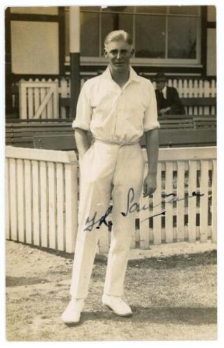 Frederick Reginald ‘Reg’ Santall. Warwickshire 1919-1939. Sepia real photograph postcard of Santall standing full length wearing cricket attire in front of a pavilion. Signed in ink to the image by Santall. Publisher unknown. Postally unused. The signatur