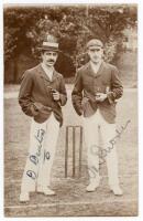 David Denton (Yorkshire & England 1894-1920) and Wilfred Rhodes (Yorkshire, Europeans & England 1899-1930). Early sepia realy photograph postcard of Denton and Rhodes standing together full length wearing cricket attire and blazers, Denton with a straw bo