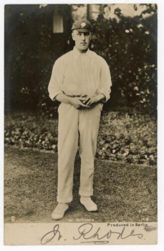 Wilfred Rhodes. Yorkshire, Europeans & England 1899-1930. Early mono real photograph postcard of Rhodes standing full length, ball in hand, wearing cricket attire and Yorkshire cap. Nicely signed in ink by Rhodes to the lower border. R. Th. series no. 741