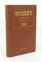 Wisden Cricketers’ Almanack 1942. 79th edition. Original hardback. Only 900 hardback copies were printed in this war year. Dulled gilt titles to spine paper, gilt titles to front board bright. Very good condition. A rare wartime edition .