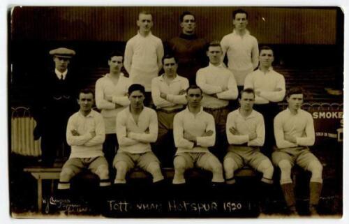 ‘Tottenham Hotspur Cup Team 1920-1’. Early mono real photograph postcard of the team and trainer, Minter, standing and seated in rows on the pitch with the stand behind, with printed title to lower border. W.J. Crawford. Postally unused. Odd very minor fa