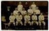 ‘Tottenham Hotspur Cup Team 1920-1’. Early mono real photograph postcard of the team and trainer, Minter, standing and seated in rows on the pitch with the stand behind, with printed title to lower border. W.J. Crawford. Postally unused. Odd very minor fa