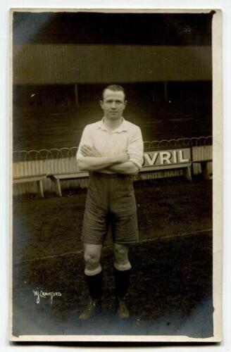 Herbert Bliss. Tottenham Hotspur 1912-1922. Early mono real photograph postcard of Bliss, full length, in Spurs attire in front of the main stand. W.J.Crawford, Edmonton. Postally unused. Good/very good condition.