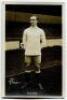 Charles Wilson. Tottenham Hotspur 1918-1923. Mono real photograph postcard of Wilson, full length, in Spurs attire in front of the main stand. W.J. Crawford of Edmonton to face of card. Postally unused. Good/very good condition.