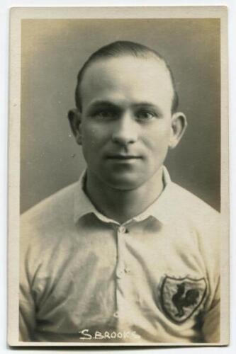 Samuel Ernest Brooks. Tottenham Hotspur 1922-1924. Mono real photograph postcard of Brooks, head and shoulders, in Spurs shirt. Name to lower border. W.J. Crawford of Edmonton. Good/very good condition Postally unused.