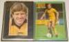 Football autographs 1970s-1990s. Black file comprising approx. two hundred mainly modern signatures of footballers. Signatures are on laid down magazine extracts, cuttings, trade cards, photographs, cards etc. Signatures include Clive Allen, Tony Adams, D