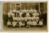 ‘Fulham Football Club 1907’. Mono real photograph postcard of the Fulham full playing staff and management standing and sitting in rows in front of a building. Publisher unknown. Postally used and dated 1909. Good condition. An early postcard.