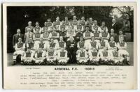 ‘Arsenal Football Club 1938-39’. Mono real photograph postcard of the Arsenal full playing staff and management standing and sitting in rows. Title and players names to lower border. Postcard by Lambert Jackson. Postally unused. A nice image. Good/very go