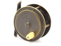 A good Hardy Hercules 2 ¾" brass trout fly reel, domed ivorine handle on brass cup, bridge foot, triple cage pillars, fixed check mechanism, raised faceplate with domed iron spindle locking screw and stamped enclosed oval logo, light wear to original pat