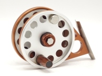 A fine and rare Ari't Hart Aras 3" trout fly reel, Philips brown/silver anodised finish left hand wind model, ventilated drum with counter-balanced handle and milled release nut, off-set foot stancheon pierced three ports, rear spindle mounted tension ad