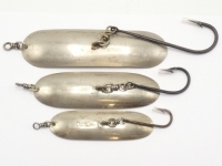 Three Hardy Wilson game/trolling spoons, graduated sizes; 6", 5" and 4" each nickel silver curved spoon bait with centrally mounted single hook and swivel and head swivel, stamped makers details, 1930's (3)