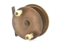 A rare early brass 3" Nottingham style centre pin reel, drum with iron cage pillars, twin turned bulbous bone handles and milled spindle locking nut, faceplate decorated with three concentric cut bands, stancheon foot mounted with milled circular brass te