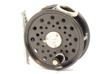 A good Hardy St George Junior trout fly reel, ebonite handle, ribbed alloy foot, three screw spring drum latch, white metal line guide, milled nickel silver rim tension screw and Mk.II check mechanism, interior stamped "J.S." (Jimmy Smith), reel retains 