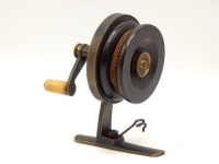 A rare J.E. Miller Chippindale brass threadline casting reel, tapered horn handle on rear mounted "S" scroll handle, stancheon foot fitted wire pig-tail line pick-up, turned rosewood spool with milled brass tension nut, backplate stamped make and model d
