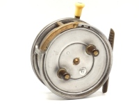 A scarce Hardy Silex Major 4" bait casting reel, shallow cored solid drum (no perforations) with twin ebonite handles, spring release button and jewelled spindle bearing, ribbed brass foot, brass auxiliary pressure rim brake, rim mounted ivorine casting t