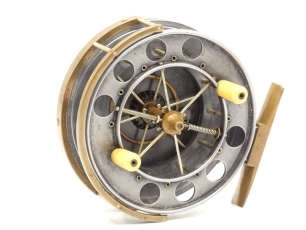 A good Allcock Aerial 4" model 7950-T3 narrow drummed centre pin reel, caged and six spoked drum with twin ivorine handles, perforated front flange (eight holes), stamped "patent" and twin regulator/release forks, B.P. line guide, brass stancheon foot, r