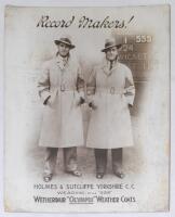 Percy Holmes and Herbert Sutcliffe. Yorkshire. ‘Record Makers’. Original large mono advertising card of Holmes and Sutcliffe standing full length wearing ‘Style 555 Wetherdair “Olympix” Weather Coats’ standing in front of a scoreboard showing their record