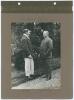 ‘Two Lancashire Captains. Father & Son 1911’. Early mono photograph of A.H. and A.N. Hornby standing facing each other in conversation. The photograph laid down to a photograph album page with handwritten title and names annotated in ink to margins. 6”x8.