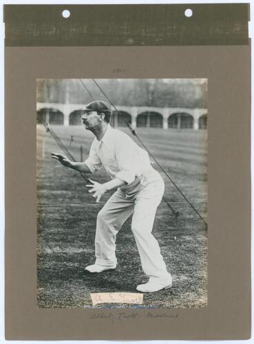 Albert Edwin Trott. Victoria, Middlesex, Australia & England 1892-1910. Early mono photograph of Trott depicted full length at fielding practice in the nets at Lord’s in 1911. The photograph laid down to a photograph album page with handwritten date and p