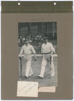 ‘Sussex 1911’. Early mono photograph of Ernest ‘Tim’ Killick and George Cox walking out to bat for Sussex in 1911. The photograph laid down to a photograph album page with handwritten title and names annotated in ink to margins, and signature in ink of Ki