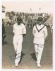 M.C.C. Australian Touring Team v C.I. Thornton&rsquo;s XI, Scarborough 1928. Original mono photograph of K.S. Duleepsinhji (Sussex) and Wilfred Rhodes (Yorkshire) walking side by side on the outfield at Scarborough with crowds in the stands, for the match playe