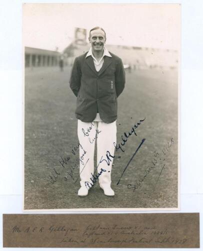Arthur Edward Robert Gilligan. Cambridge University, Surrey, Sussex & England 1919-1932. Original sepia photograph of Gilligan depicted full length wearing cricket attire and England blazer at Scarborough with the scoreboard and grandstand in the backgrou
