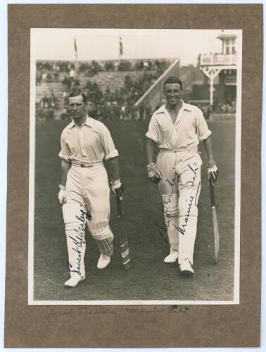M.C.C. Australian Touring Team v C.I. Thornton&rsquo;s XI, Scarborough 1928. Original mono photograph of Ernest Tyldesley (Lancashire) and Maurice Tate (Sussex) walking walking out to bat for M.C.C. at Scarborough with crowds in the stands in the background, fo