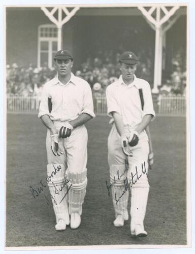 South Africa tour to England 1929. C.I. Thornton’s XI v South Africans. Original mono photograph of the South African batsmen Jack Siedle and Bruce Mitchell walking walking out to bat at Scarborough with the crowded pavilion in the background, for the mat